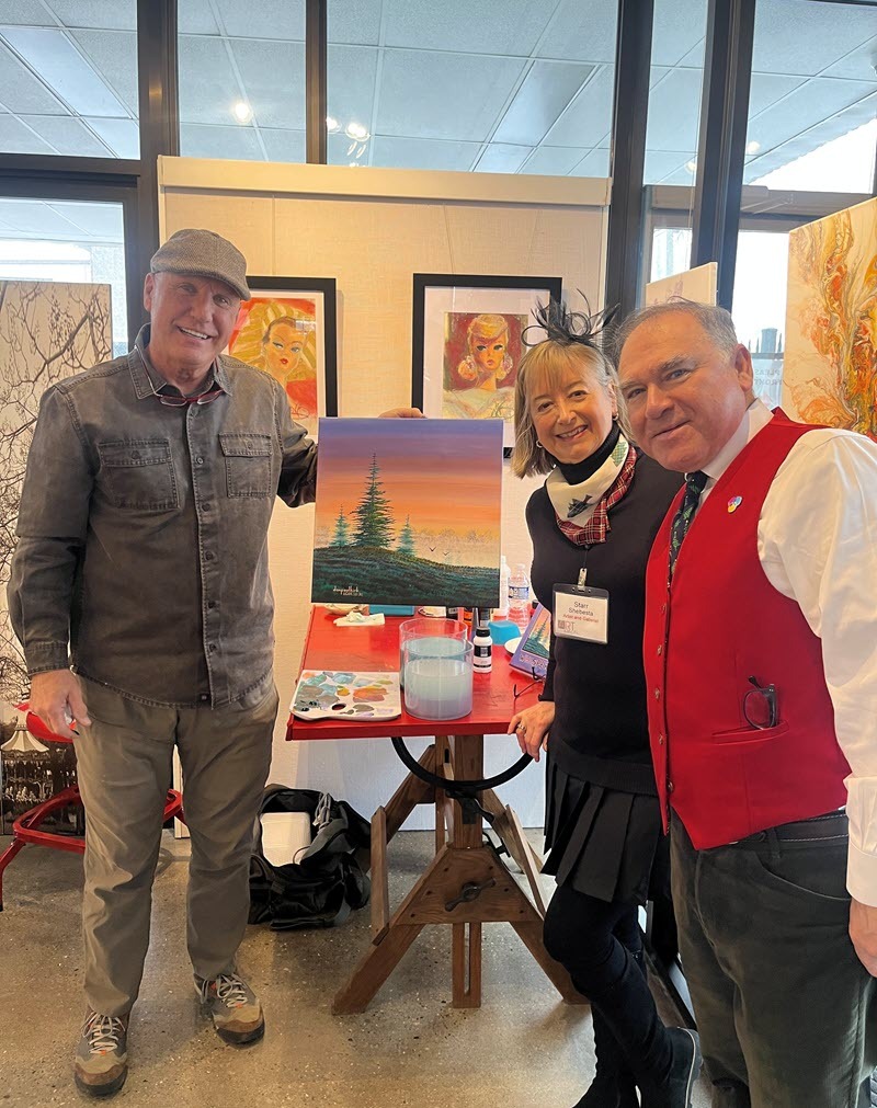 Don Paul Kirk next to a painting he created during our Afternoon Tea!